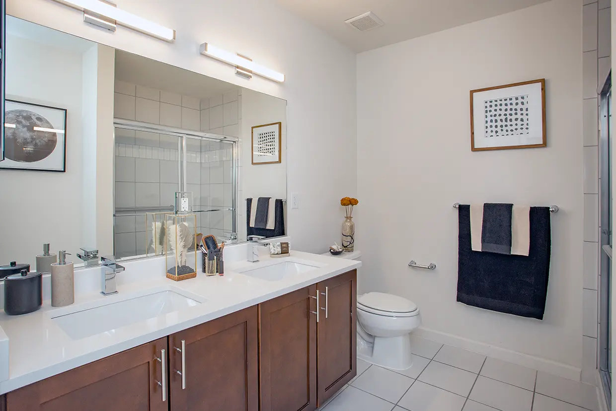 Updated Bathrooms Include New Vanity Countertops, Sinks, Faucets and Modern Lighting